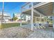 Inviting outdoor patio provides a tranquil spot with cozy seating overlooking the grassy yard at 6912 S Atlantic Ave, New Smyrna Beach, FL 32169