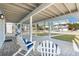 Charming patio with comfortable seating and serene views of the surrounding neighborhood at 6912 S Atlantic Ave, New Smyrna Beach, FL 32169