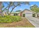 House with green metal roof and landscaped yard at 817 W 9Th St, Deltona, FL 32725