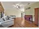 Living room featuring hardwood floors and comfy seating at 817 W 9Th St, Deltona, FL 32725