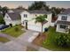 Two-story house with a large backyard and a paved driveway at 8747 Isla Bella Dr, Orlando, FL 32818