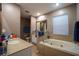 Bathroom features garden tub and double vanity at 8747 Isla Bella Dr, Orlando, FL 32818