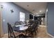 Dining room features a dark wood table and chairs, and an open view to the kitchen at 8747 Isla Bella Dr, Orlando, FL 32818