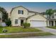 Two-story house with a two-car garage at 8747 Isla Bella Dr, Orlando, FL 32818