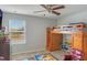 bedroom with a bunk bed, desk, and ample storage at 887 Panical Dr, Apopka, FL 32703