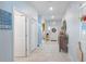 Hallway with light walls, tile floors, and access to other rooms at 887 Panical Dr, Apopka, FL 32703