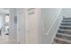 Stairwell with grey carpeting and white doors at 887 Panical Dr, Apopka, FL 32703