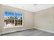 Bright bedroom with a large window and laminate flooring at 8981 Lee Vista Blvd # 2209, Orlando, FL 32829