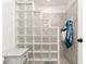 Bathroom with glass block shower feature and gray vanity at 282 S Fox Chase Pt, Longwood, FL 32779