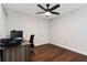 Home office with wood flooring, desk, and ceiling fan at 282 S Fox Chase Pt, Longwood, FL 32779