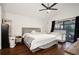 Spacious main bedroom with king-size bed and access to patio at 282 S Fox Chase Pt, Longwood, FL 32779