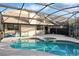 Relaxing screened-in pool and spa behind the house at 282 S Fox Chase Pt, Longwood, FL 32779