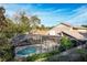 Aerial view of a private pool with a screened enclosure at 282 S Fox Chase Pt, Longwood, FL 32779