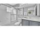 Clean bathroom with shower/tub combo, vanity with a quartz countertop, and a mirror at 1087 Park Ridge Cir, Kissimmee, FL 34746