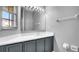 Bathroom with vanity, mirror, and white countertop at 1087 Park Ridge Cir, Kissimmee, FL 34746