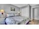 Bedroom with king-size bed and double doors to closet at 1087 Park Ridge Cir, Kissimmee, FL 34746