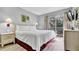 King-size bed, dresser, and sliding door to private balcony at 1087 Park Ridge Cir, Kissimmee, FL 34746