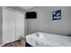 Small bedroom with a twin bed, a closet, and a TV mounted on the wall at 1087 Park Ridge Cir, Kissimmee, FL 34746