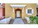 Front entrance of townhome with walkway and landscaping at 1087 Park Ridge Cir, Kissimmee, FL 34746