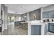 Open kitchen with island, stainless steel appliances, and breakfast bar at 1087 Park Ridge Cir, Kissimmee, FL 34746