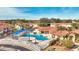 Community pool with plenty of lounge chairs and shade structures at 1087 Park Ridge Cir, Kissimmee, FL 34746