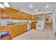 View of kitchen with wood cabinets and stainless steel appliances at 137 S Deerwood Ave, Orlando, FL 32825