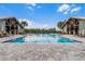 Large community swimming pool with dual pavilions and ample lounge seating at 14310 Shocklach Dr, Winter Garden, FL 34787