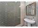 Stylish bathroom with a pedestal sink and herringbone tile at 14493 Swanley St, Orlando, FL 32832