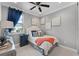 Cozy bedroom with a full-size bed, gray walls, and sports decor at 14493 Swanley St, Orlando, FL 32832