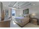 Main bedroom with tray ceiling, large window, and neutral decor at 14493 Swanley St, Orlando, FL 32832