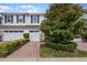 Townhome with two-car garage and manicured landscaping at 14493 Swanley St, Orlando, FL 32832