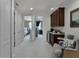 Spacious hallway with access to bedrooms and wet bar at 14493 Swanley St, Orlando, FL 32832