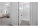 Clean bathroom with walk-in shower and patterned floor at 15810 Shorebird Ln, Winter Garden, FL 34787