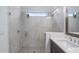 Modern bathroom with a large walk-in shower and double vanity at 15810 Shorebird Ln, Winter Garden, FL 34787