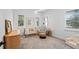Neutral Bedroom with crib, armchair, and plenty of natural light at 15810 Shorebird Ln, Winter Garden, FL 34787