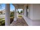 Elegant front porch with columns and paver flooring at 15810 Shorebird Ln, Winter Garden, FL 34787