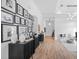 Bright hallway with wood floors and gallery wall display at 15810 Shorebird Ln, Winter Garden, FL 34787