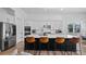 Modern kitchen with white cabinets, center island, and stainless steel appliances at 15810 Shorebird Ln, Winter Garden, FL 34787