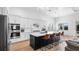 Modern kitchen with a large island, stainless steel appliances, and white cabinets at 15810 Shorebird Ln, Winter Garden, FL 34787