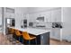 Spacious kitchen with white cabinets, stainless steel appliances, and a large island at 15810 Shorebird Ln, Winter Garden, FL 34787