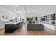 Open floor plan with modern kitchen, island, and spacious living area at 15810 Shorebird Ln, Winter Garden, FL 34787