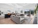 Bright and airy living room with large windows and comfortable seating at 15810 Shorebird Ln, Winter Garden, FL 34787