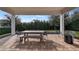Covered patio with seating area and fire pit at 15810 Shorebird Ln, Winter Garden, FL 34787