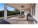 Covered patio with outdoor dining set and built-in grill at 15810 Shorebird Ln, Winter Garden, FL 34787
