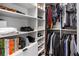 Custom-designed walk-in closet with shelves and hanging rods at 15810 Shorebird Ln, Winter Garden, FL 34787