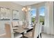 Elegant dining room featuring a spacious table and large windows at 1688 Three Bars Rd, Kissimmee, FL 34744