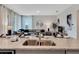 Kitchen island with granite countertop and double sink overlooking living room at 1688 Three Bars Rd, Kissimmee, FL 34744