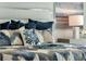 Main bedroom detail with blue and beige bedding at 1688 Three Bars Rd, Kissimmee, FL 34744
