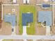 Three-house aerial showing similar homes with yards at 16895 Sw 50Th Cir, Ocala, FL 34473