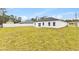 Spacious backyard with a large grassy area at 16895 Sw 50Th Cir, Ocala, FL 34473